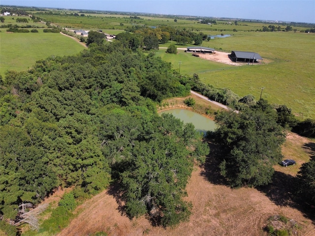 aerial view featuring a rural view and a water view