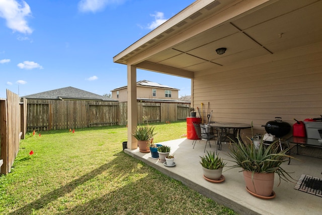 view of yard featuring a patio area and a fenced backyard