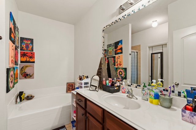 full bath featuring a stall shower, vanity, and a bath