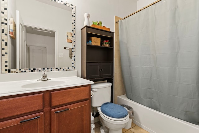 bathroom featuring shower / tub combo, vanity, toilet, and tile patterned floors