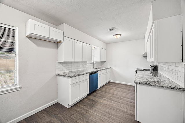 kitchen featuring dishwashing machine, white cabinetry, light stone counters, and dark wood-type flooring