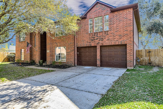 traditional-style home featuring a garage, brick siding, driveway, and fence