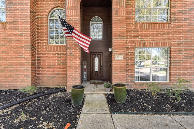 entrance to property with brick siding