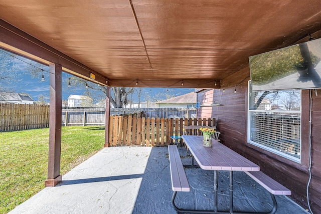 view of patio featuring fence