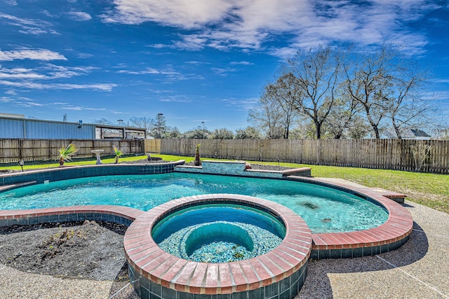 view of pool with a fenced backyard and a pool with connected hot tub