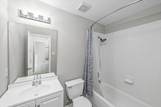 full bath featuring toilet, shower / bath combo, visible vents, and vanity