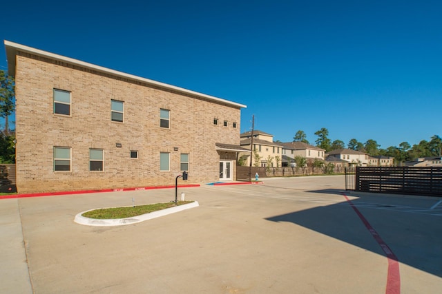 view of street featuring curbs and a gated entry