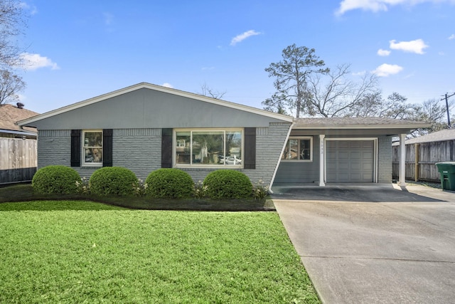 single story home with fence, concrete driveway, a front yard, an attached garage, and brick siding