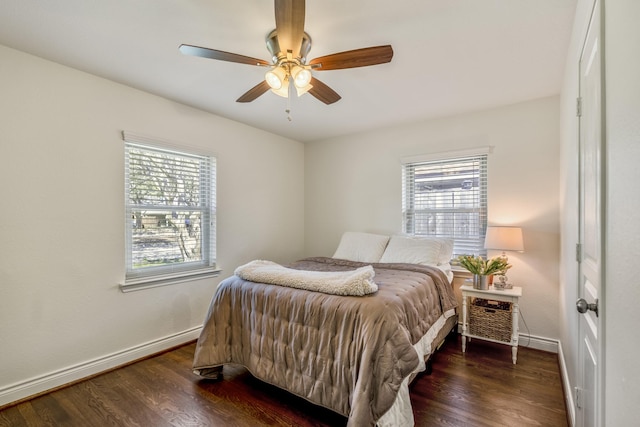 bedroom featuring a ceiling fan, wood finished floors, and baseboards