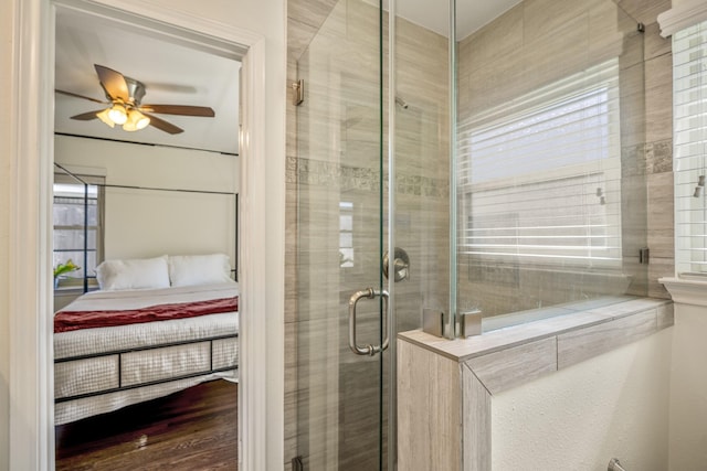 bathroom featuring a shower stall, ensuite bath, and a ceiling fan