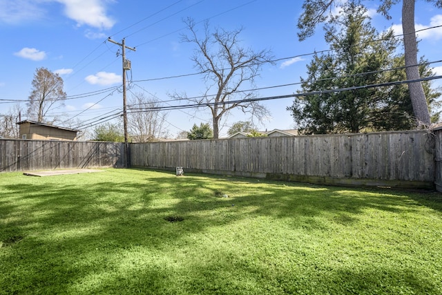 view of yard with a fenced backyard