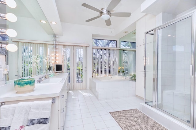 full bath with vanity, a ceiling fan, a stall shower, tile patterned flooring, and a garden tub