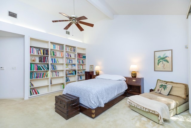 bedroom featuring beam ceiling, a ceiling fan, visible vents, and carpet floors