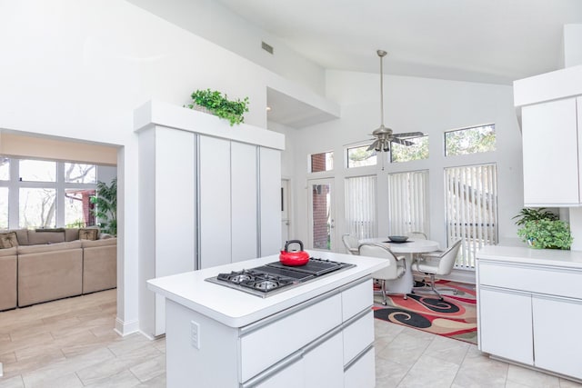 kitchen with light countertops, visible vents, stainless steel gas cooktop, and ceiling fan