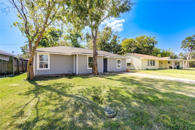 ranch-style home featuring a front yard and fence