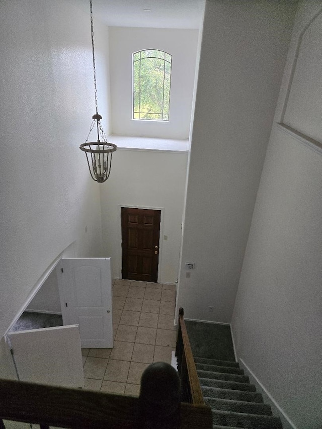 stairway featuring tile patterned floors