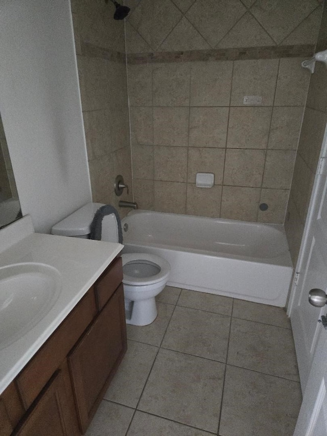 bathroom featuring bathtub / shower combination, tile patterned floors, toilet, and vanity