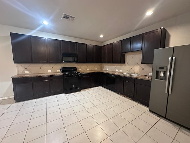 kitchen featuring visible vents, backsplash, black appliances, a sink, and recessed lighting