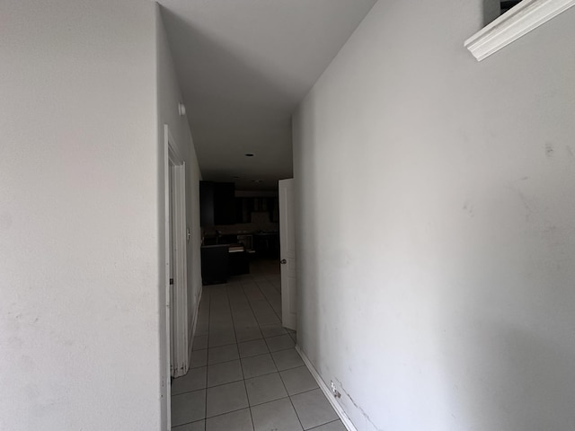 hallway featuring light tile patterned floors