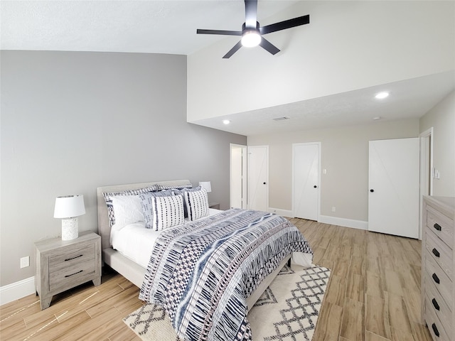 bedroom with recessed lighting, light wood-style flooring, a ceiling fan, high vaulted ceiling, and baseboards