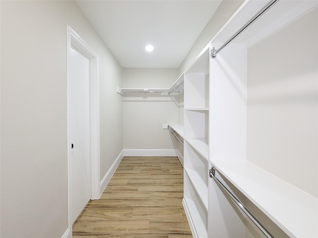 spacious closet featuring light wood-style floors