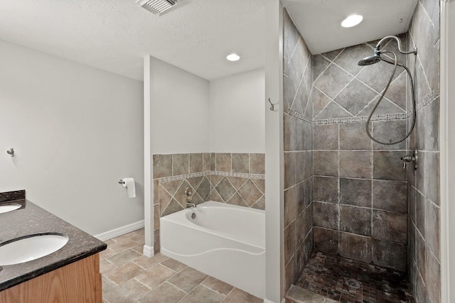 full bathroom with a sink, visible vents, tiled shower, a bath, and double vanity