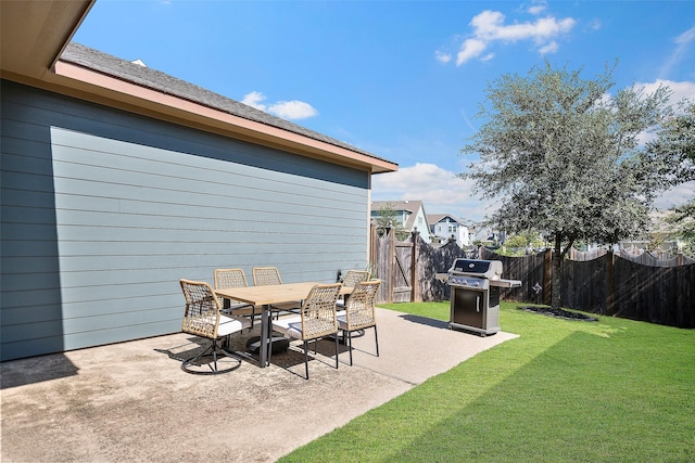 view of patio / terrace with outdoor dining area, a grill, a gate, and fence