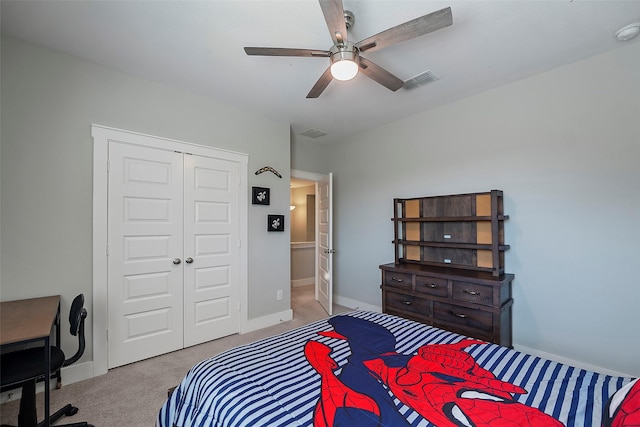 carpeted bedroom with baseboards, visible vents, ceiling fan, and a closet