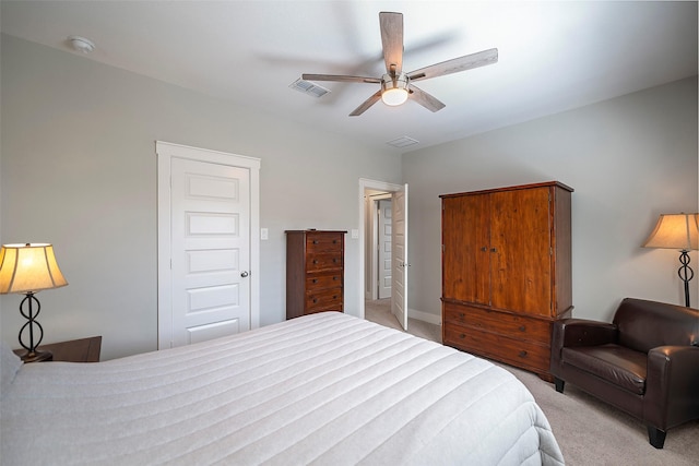 bedroom with light colored carpet, visible vents, and ceiling fan