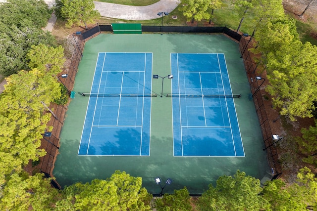 view of tennis court with fence