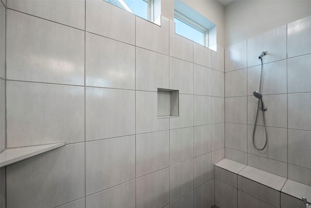 full bath with tiled shower