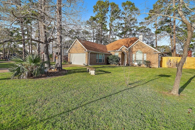 view of front of property with a garage, a chimney, fence, a front lawn, and brick siding