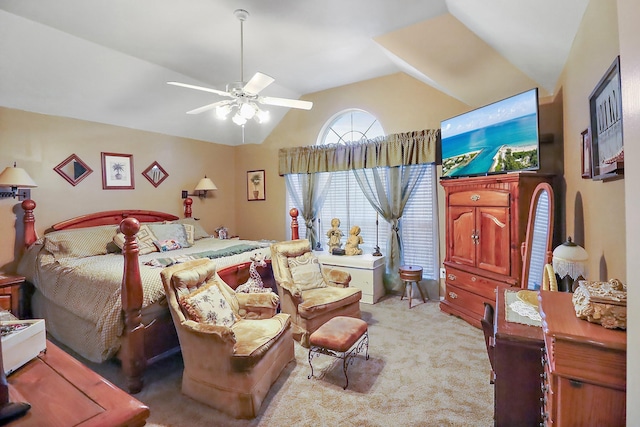 bedroom with carpet floors, lofted ceiling, and ceiling fan