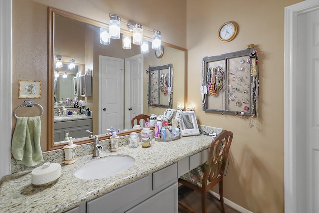 bathroom featuring vanity and baseboards