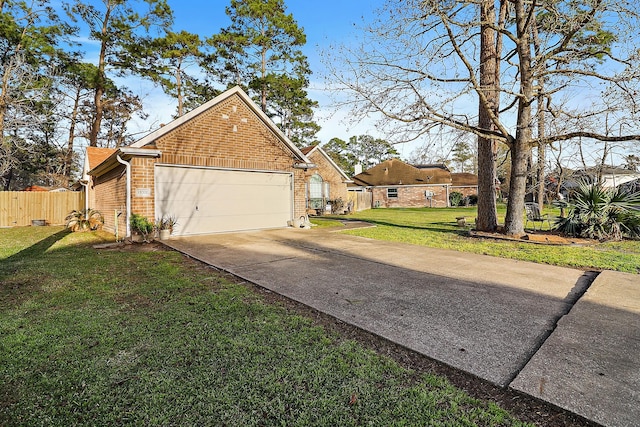 view of side of property with brick siding, a yard, an attached garage, fence, and driveway