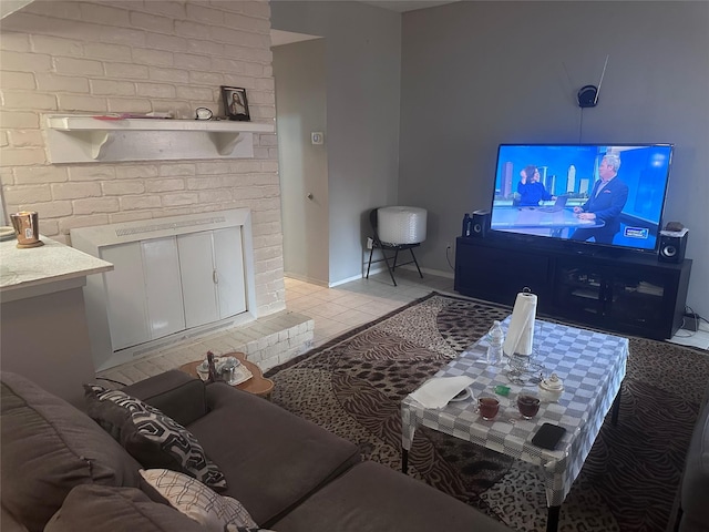 living area with light tile patterned flooring and baseboards