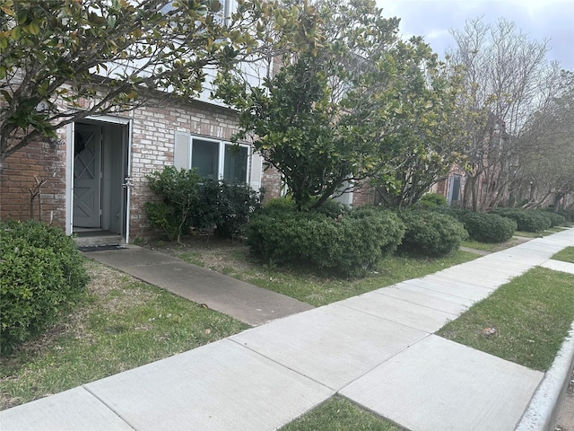 exterior space with brick siding