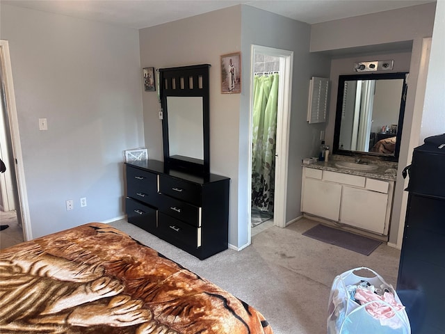 bedroom featuring light carpet, baseboards, and a sink