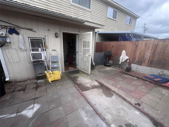 view of patio featuring fence and cooling unit