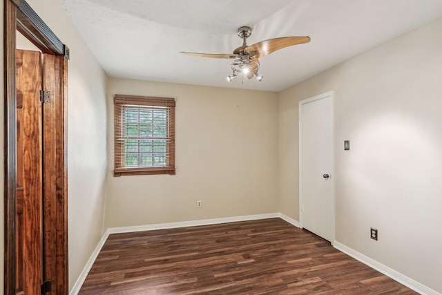 5503 Bayou Blvd, Baytown, TX 77521 - unfurnished room with ceiling fan, baseboards, and dark wood finished floors