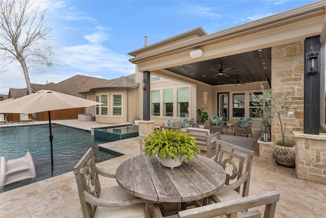 139 Ballantyne Dr, Montgomery, TX 77316 - view of patio / terrace with outdoor dining area, a ceiling fan, a pool with connected hot tub, and an outdoor hangout area