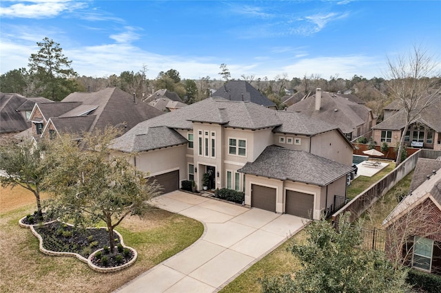 139 Ballantyne Dr, Montgomery, TX 77316 - view of front facade featuring a residential view, concrete driveway, stucco siding, and fence