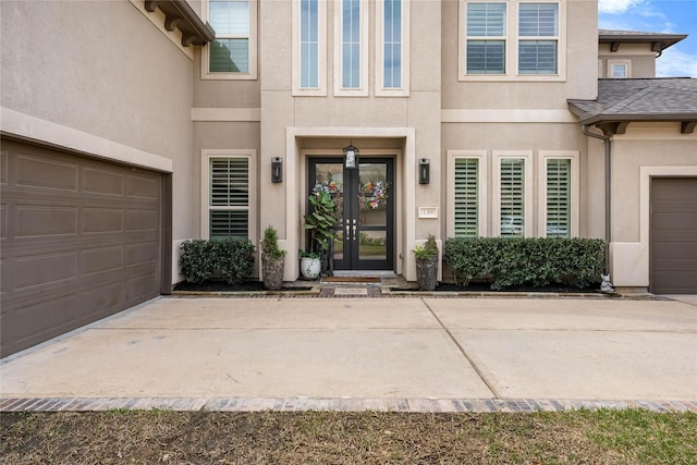 139 Ballantyne Dr, Montgomery, TX 77316 - doorway to property with stucco siding, a garage, and french doors