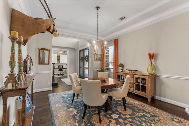 139 Ballantyne Dr, Montgomery, TX 77316 - dining area with baseboards, dark wood-style flooring, visible vents, and crown molding