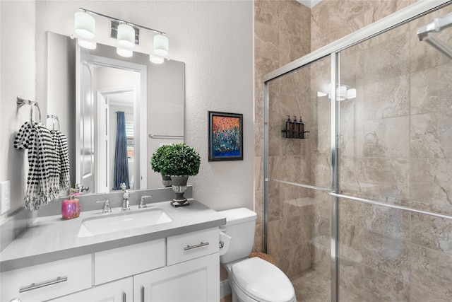 139 Ballantyne Dr, Montgomery, TX 77316 - bathroom with a shower stall, toilet, vanity, and a textured wall