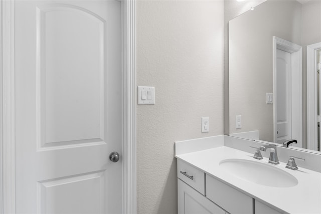 139 Ballantyne Dr, Montgomery, TX 77316 - bathroom featuring vanity and a textured wall