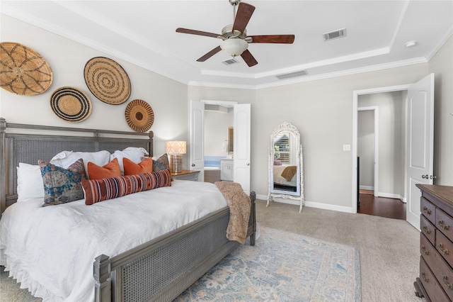 139 Ballantyne Dr, Montgomery, TX 77316 - carpeted bedroom featuring a tray ceiling, baseboards, and visible vents