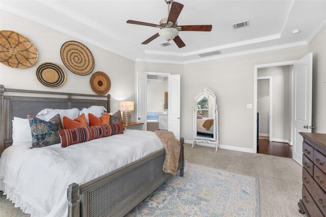 139 Ballantyne Dr, Montgomery, TX 77316 - bedroom featuring a tray ceiling, carpet flooring, ceiling fan, ornamental molding, and ensuite bath