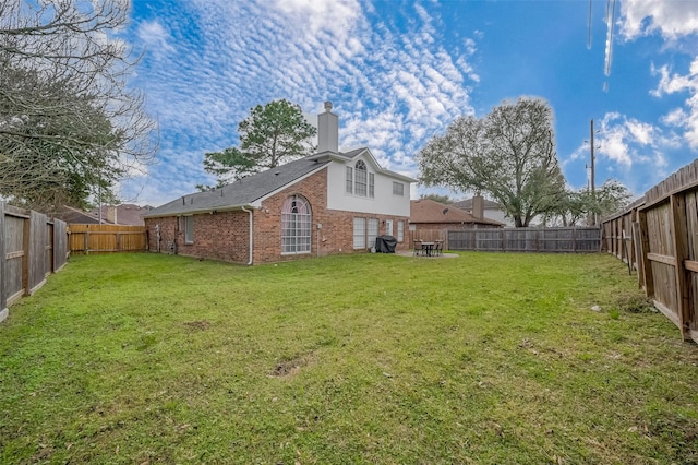 view of yard featuring a fenced backyard