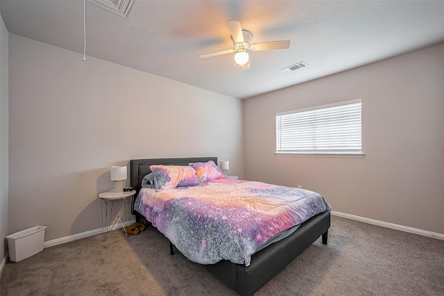 bedroom featuring baseboards, attic access, visible vents, and carpet flooring